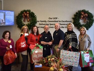 Lasting Partners in The Community—Rubicon And APSO, Rubicon Employees with Christmas gifts