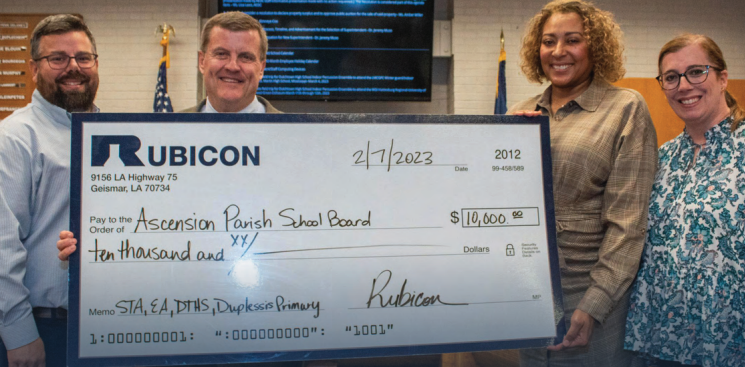 Rubicon Employees with donation, Rubicon Donates to Ascension Parish School Board